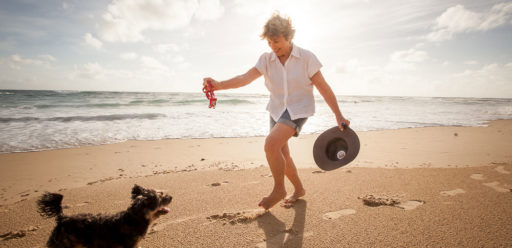 Lady with dog doing balance exercsises